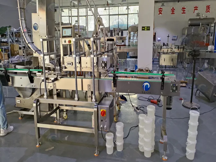 How Much Does An Automatic Peanut Butter Filling Machine Cost? 8 Automatic cap lifting and capping machine