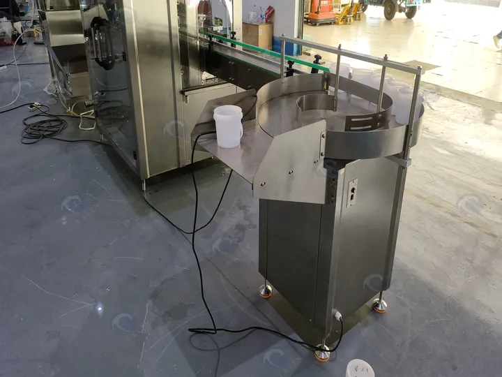 How Much Does An Automatic Peanut Butter Filling Machine Cost? 3 Bottle unscrambler machine for sale